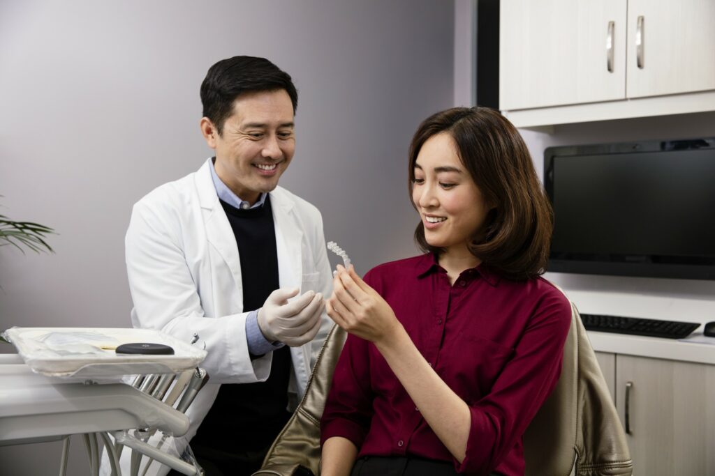 Orthodontist showing Invisalign clear aligners