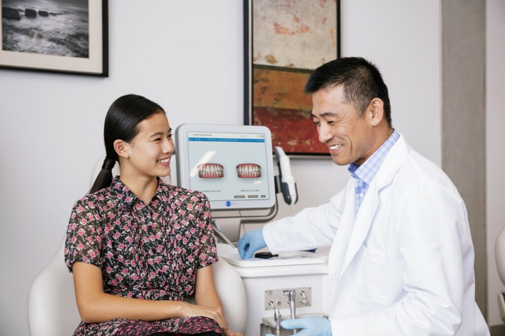 Orthodontist consulting about Invisalign clear aligners